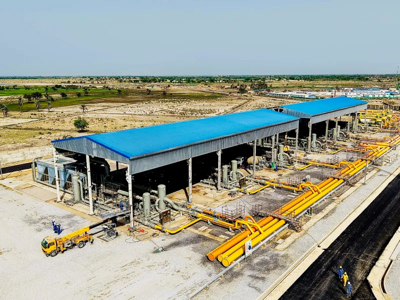 Aerial view of a gas compression station with compressor packages and gas headers