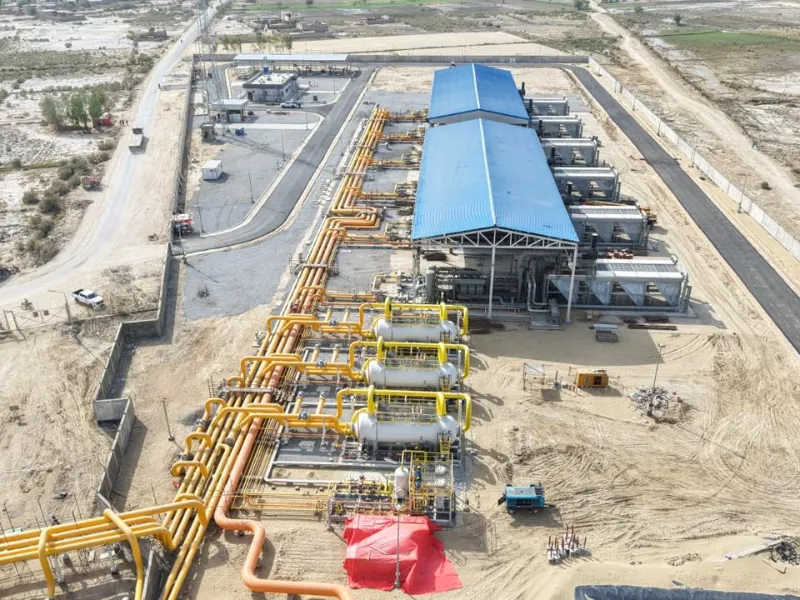 Top down aerial view of compressor sheds, gas headers and scrubbers